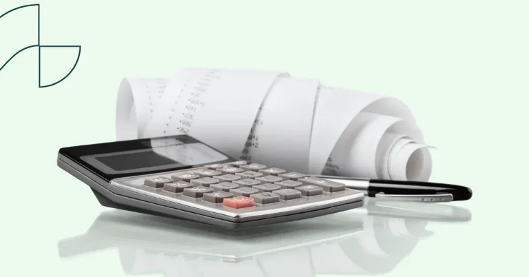Accounting tools a calculator with a pen and some receipts