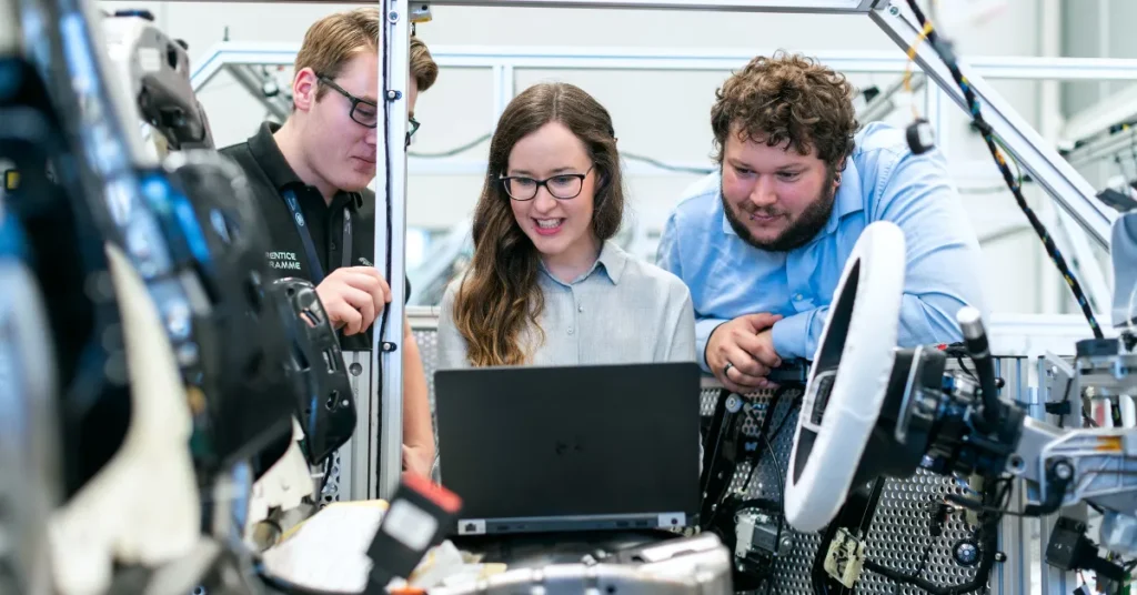 Three engineers collaborating on a project