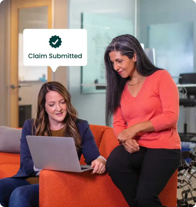 Two women discussing a R&D Tax Claim on a laptop