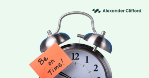 Alarm clock with an orange sticky note reading ‘Be on time!'